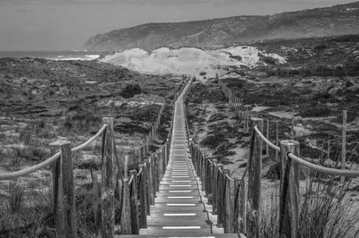 Footbridge leading towards mountain