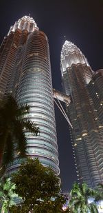 Low angle view of modern buildings at night