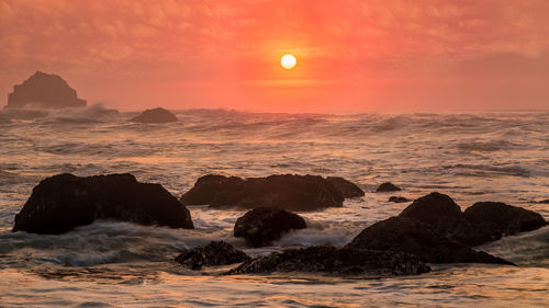 Scenic view of sea against sky during sunset