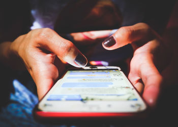 Close-up of woman using mobile phone