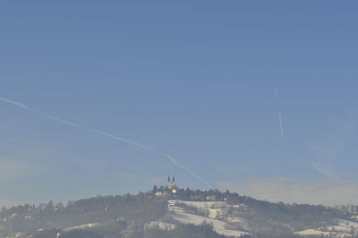 Scenic view of vapor trails in sky