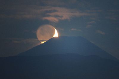 Low angle view of moon against sky at night