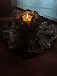 High angle view of illuminated lamp on table