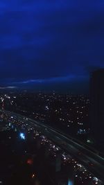 High angle view of illuminated city buildings at night