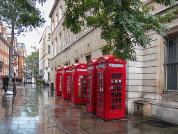 Red road sign on street in city