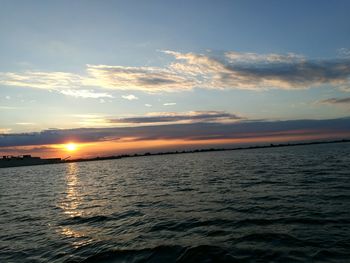 Scenic view of sea at sunset