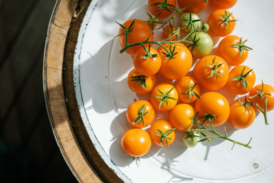 High angle view of tomatoes on plate on table
