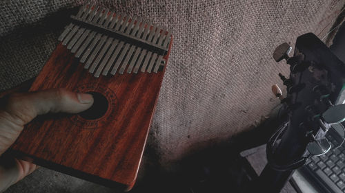 High angle view of man playing piano