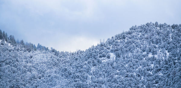 Scenic view of snow covered mountain against sky