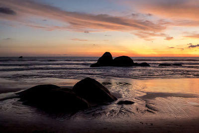 Scenic view of sea against sky during sunset