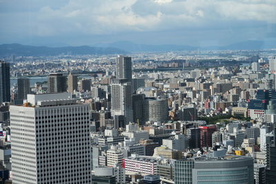 High angle view of buildings in city against sky