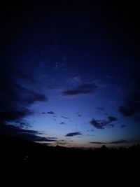 Low angle view of dramatic sky at night