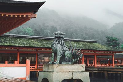 Statue of building in foggy weather