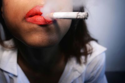 Close-up of woman smoking cigarette