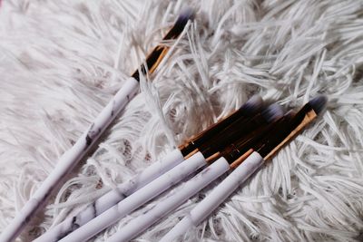 Close-up of make-up brushes on carpet