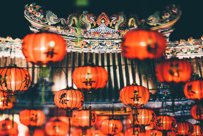 Close-up of illuminated lanterns hanging