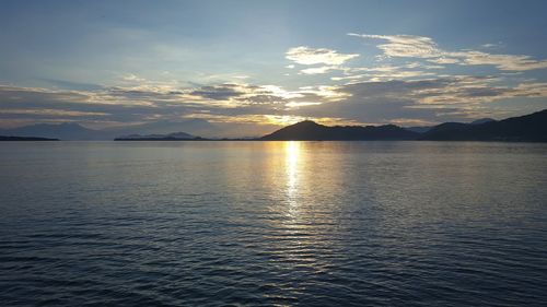 Scenic view of sea against sky at sunset