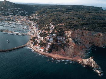 High angle view of sea by buildings in city