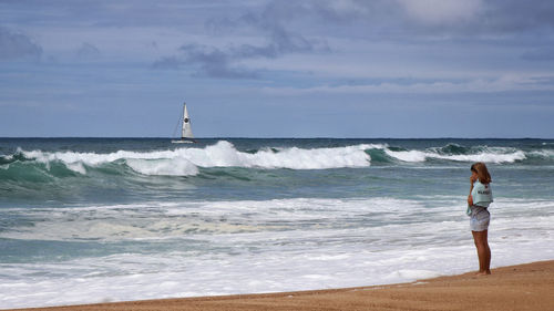 Man looking at sea against sky