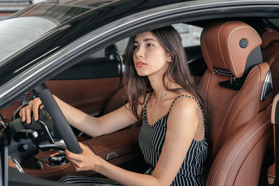 Portrait of woman in car