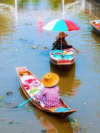 High angle view of multi colored boat moored in lake