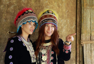 Portrait of smiling young woman wearing hat