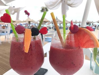 Close-up of fruits on glass table