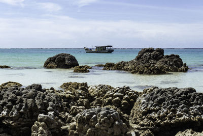 Beautiful tureloto beach in nias island, north sumatra, indonesia. blue sea, clear sky, coral reef