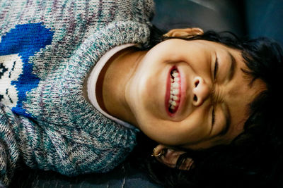 Portrait of cute boy lying down