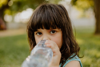 Child drinking water from bottle