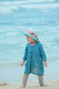 Full length of woman standing in sea