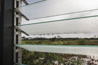 Close-up of railing against sky