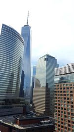 Modern buildings in city against sky