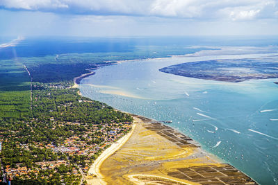 High angle view of sea shore against sky