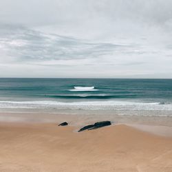 Scenic view of beach against sky