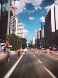 City street and buildings against sky