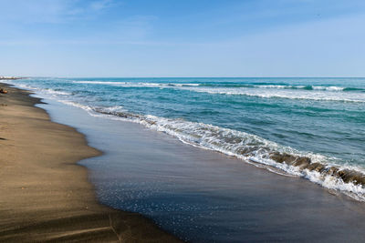 Beautiful sea and the black sandy beach, tyrrhenian sea near roma, italy