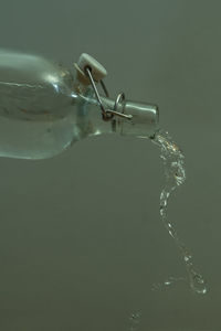 Close-up of water splashing against white background