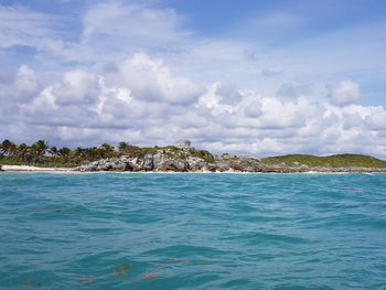 Panoramic view of tulum from sea against sky