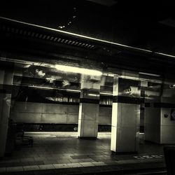 Empty parking lot in building at night