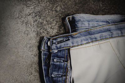 Close-up of jeans on table