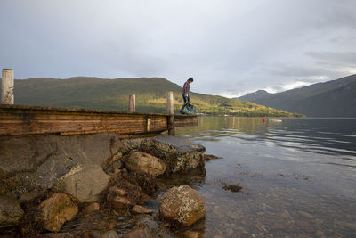 A man planning to drop some crab pots in the fjord