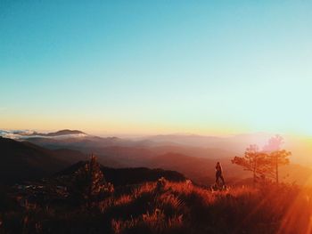 Scenic view of mountains against clear blue sky