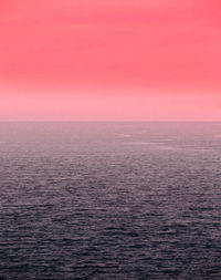 Scenic view of sea against clear sky during sunset