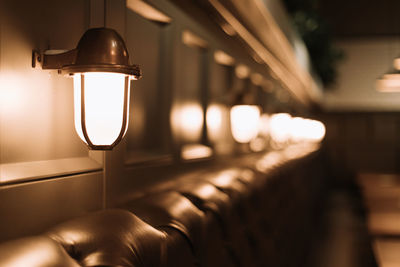 Close-up of illuminated lamp in building