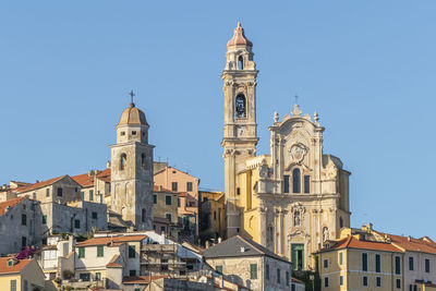 Low angle view of buildings against blue sky