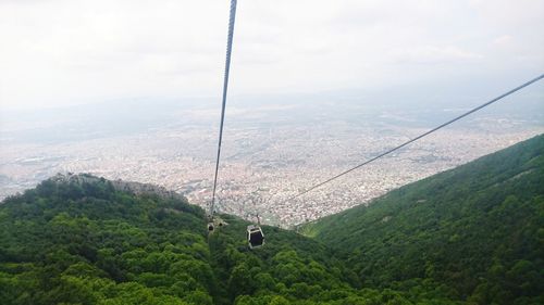 High angle view of overhead cable car against sky