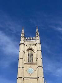 Low angle view of clock tower against sky