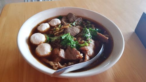 Pork soup in white bowl, kao lao