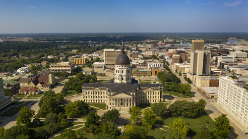 High angle view of buildings in town against sky